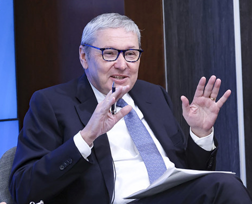 Greg Mankiw mid-gesture during a panel discussion