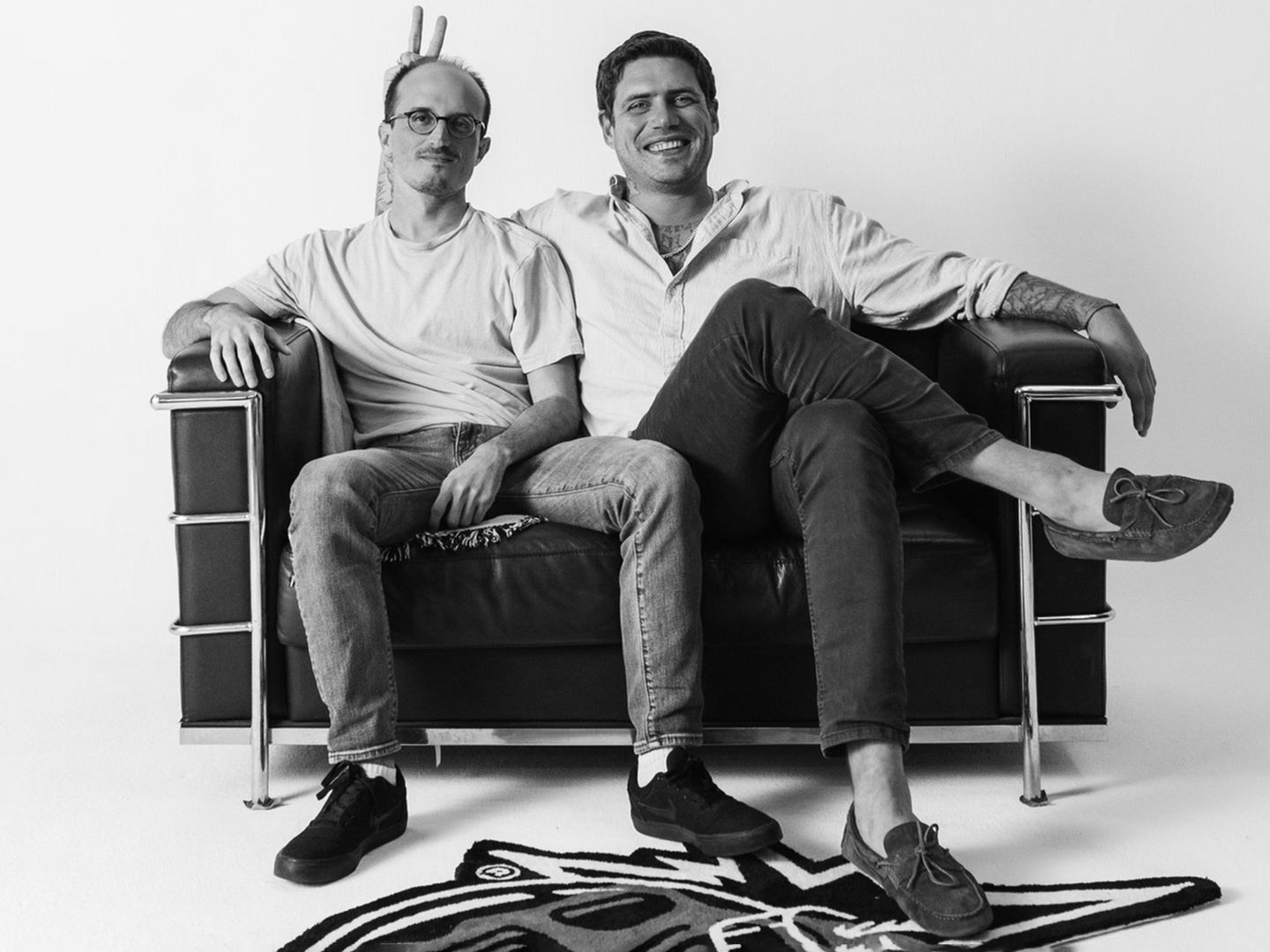 Greg Solano, left, and Yuga Labs co-founder Wylie Aronow sitting together on a sofa