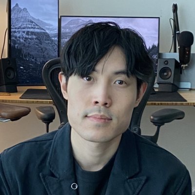 Greg Yang seated at a workstation in a photograph from his public X profile