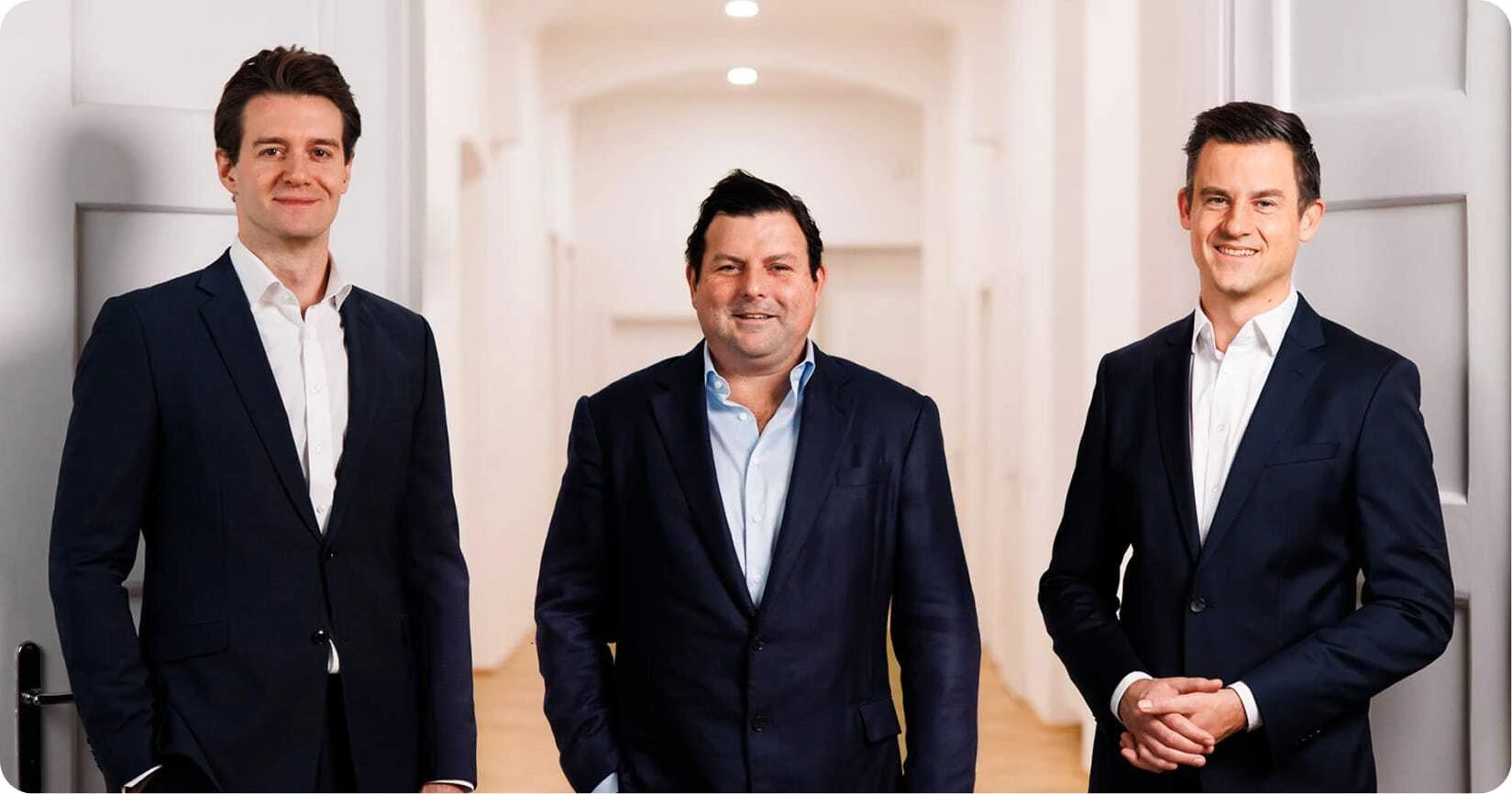 Blackvolt Energy's management team standing together in a bright office corridor