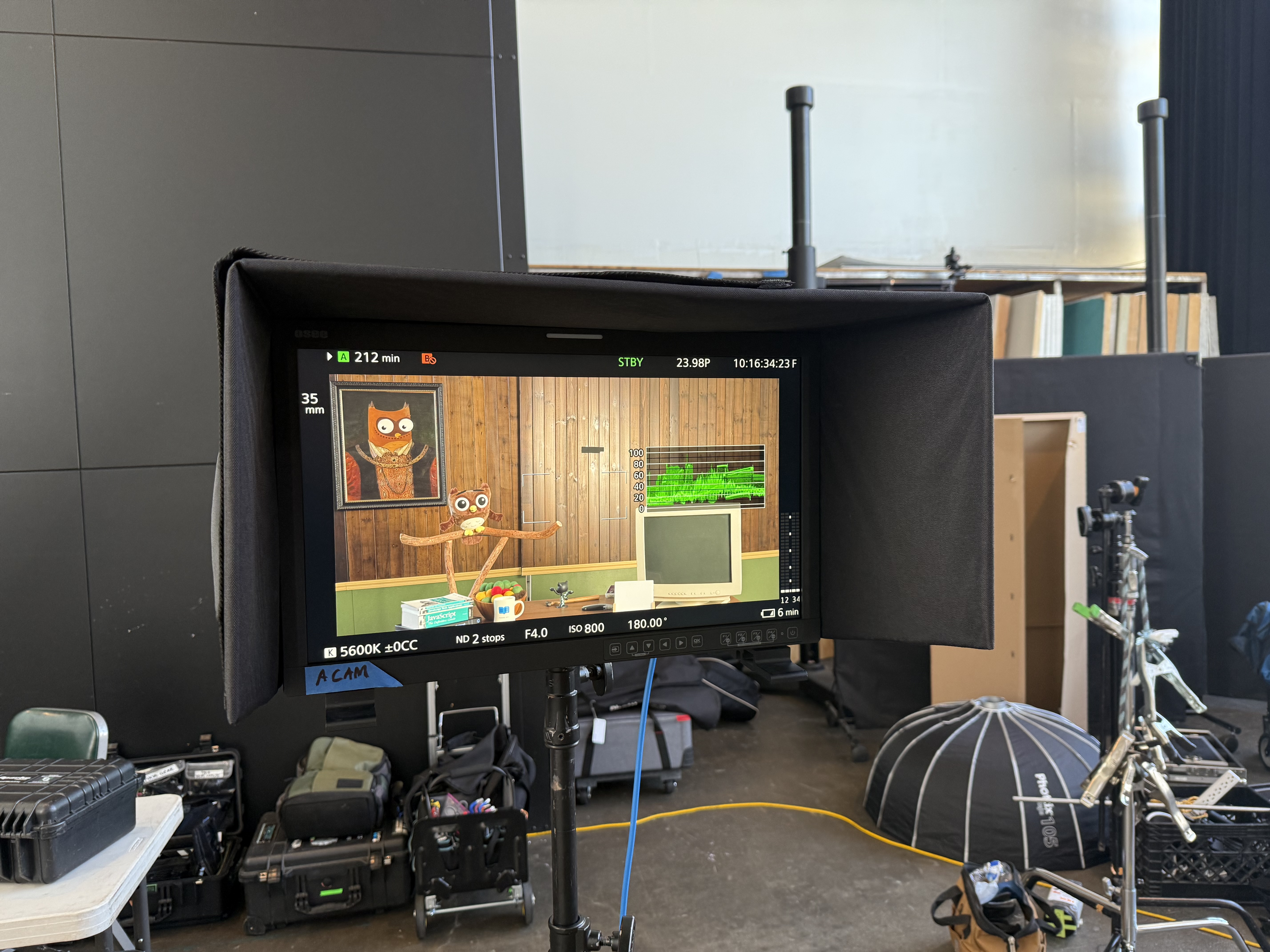 A camera monitor showing an owl character on the practical set for ReadMe’s launch video