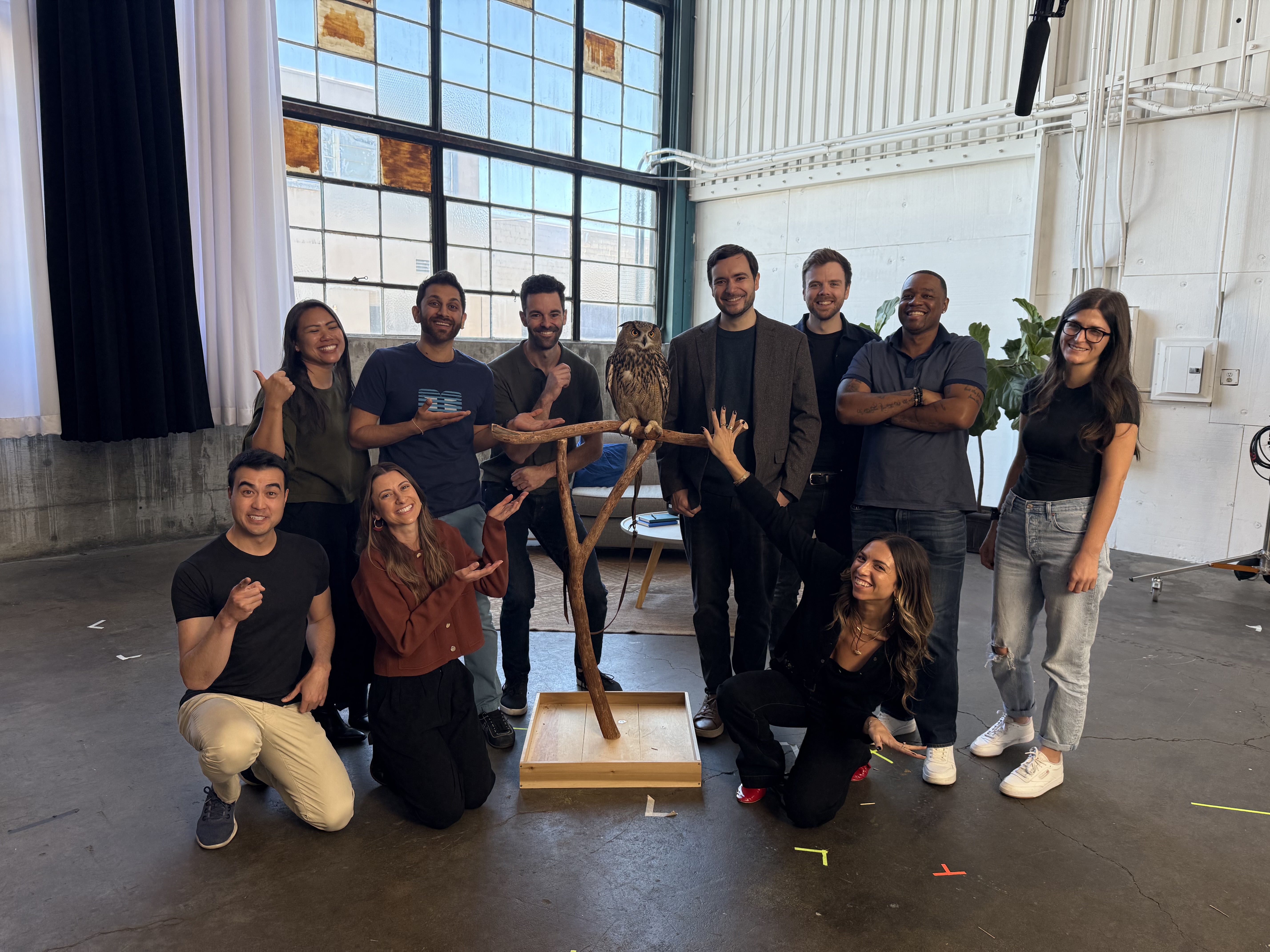 Gregory Koberger with the production team and an owl on the ReadMe Refactored launch set