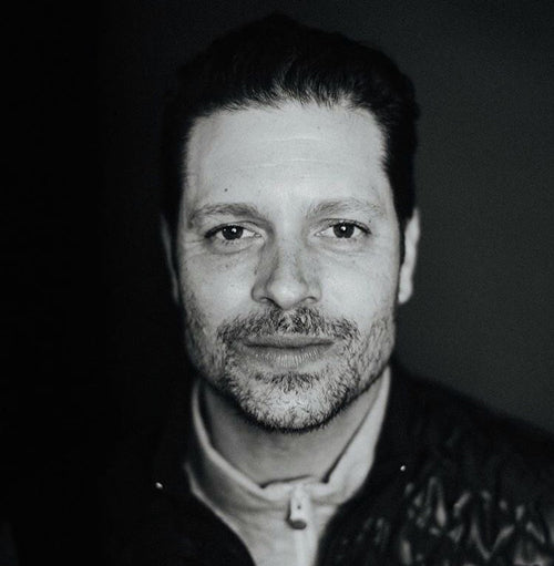 Black-and-white portrait of Greyson founder and CEO Charlie Schaefer