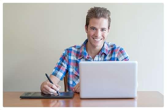 Growing Stars promotional photograph of a learner using a laptop and digital writing tablet