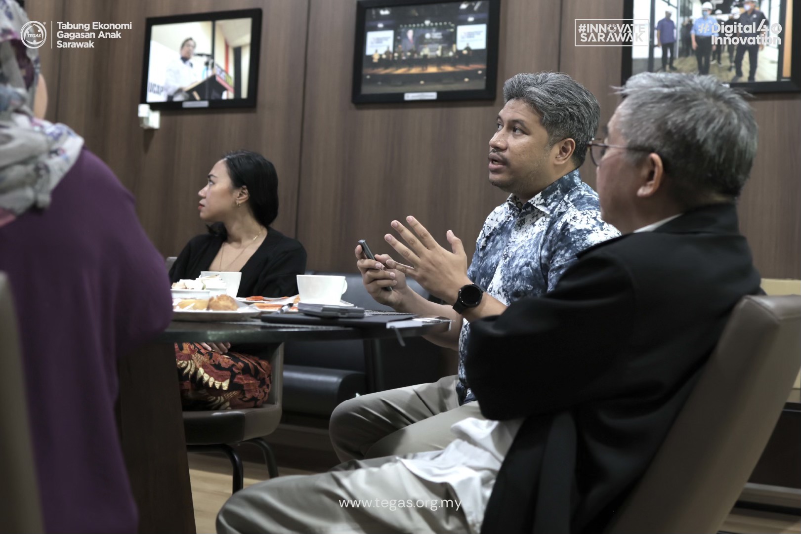 Growth Charger representatives in discussion during a visit to TEGAS Digital Village