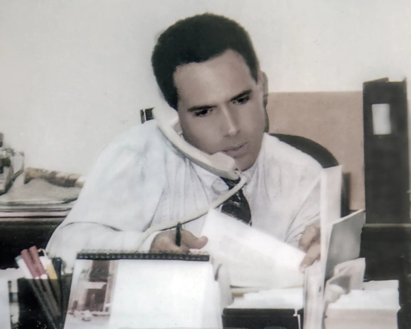 Historical photograph of Enrique Ricky Adsuar González in his office