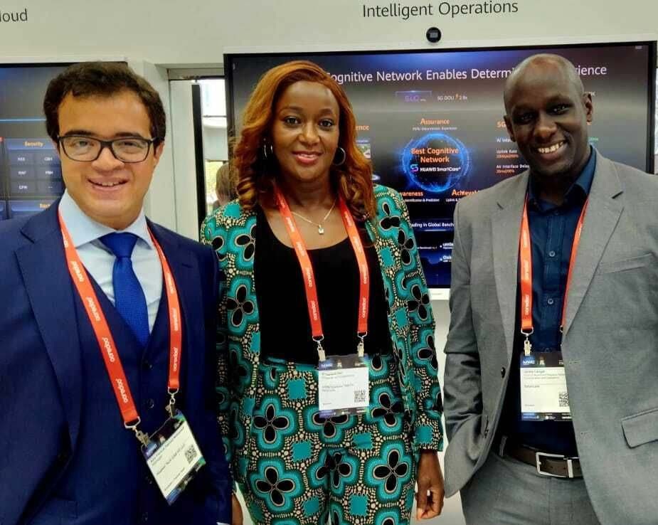 Three members of the NetLife team standing together at MWC Doha 2025