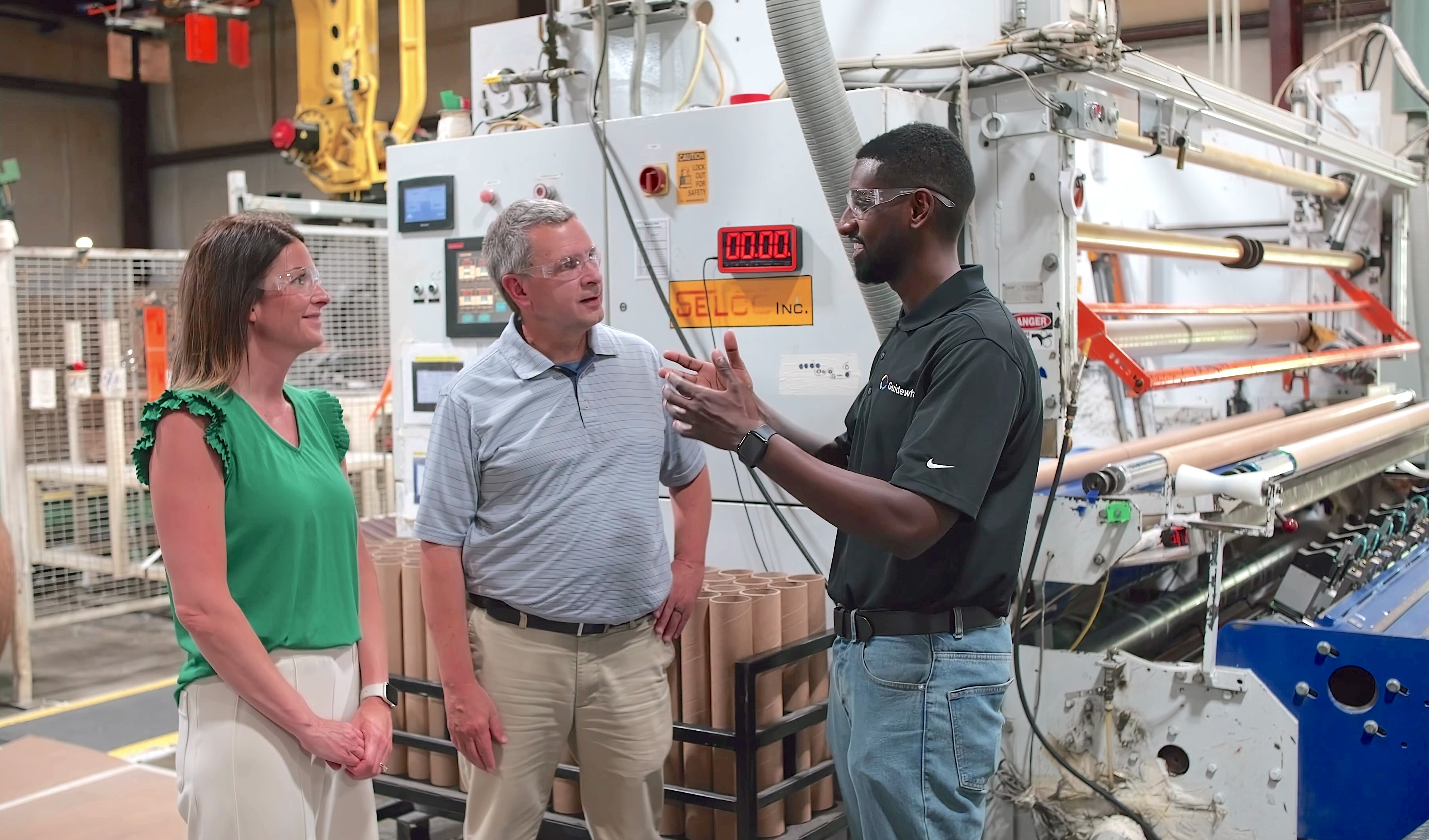 Guidewheel employee working with manufacturing customers on a factory floor