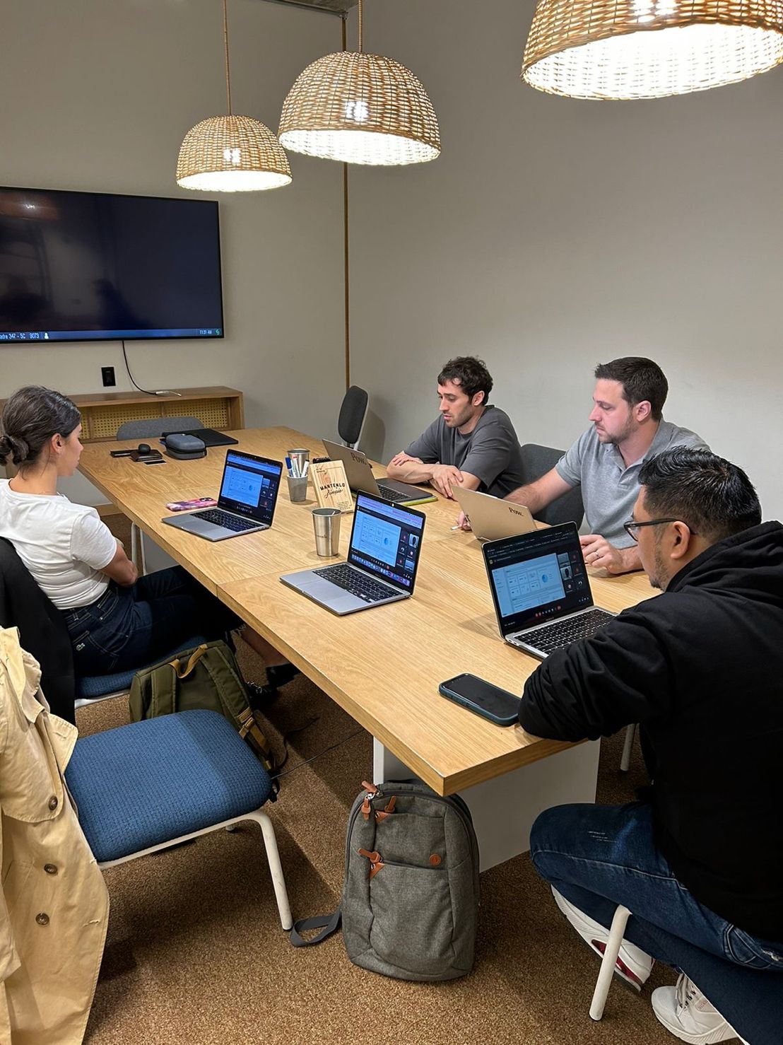 Guido Ginesi and colleagues with laptops around a meeting table