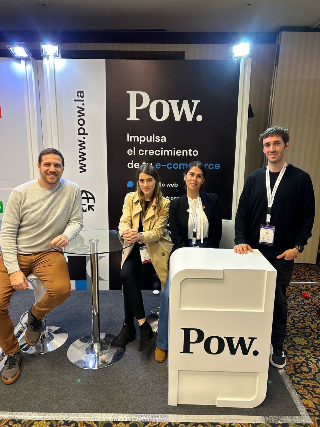 Guido Ginesi, at right, and three Pow colleagues beside their conference booth