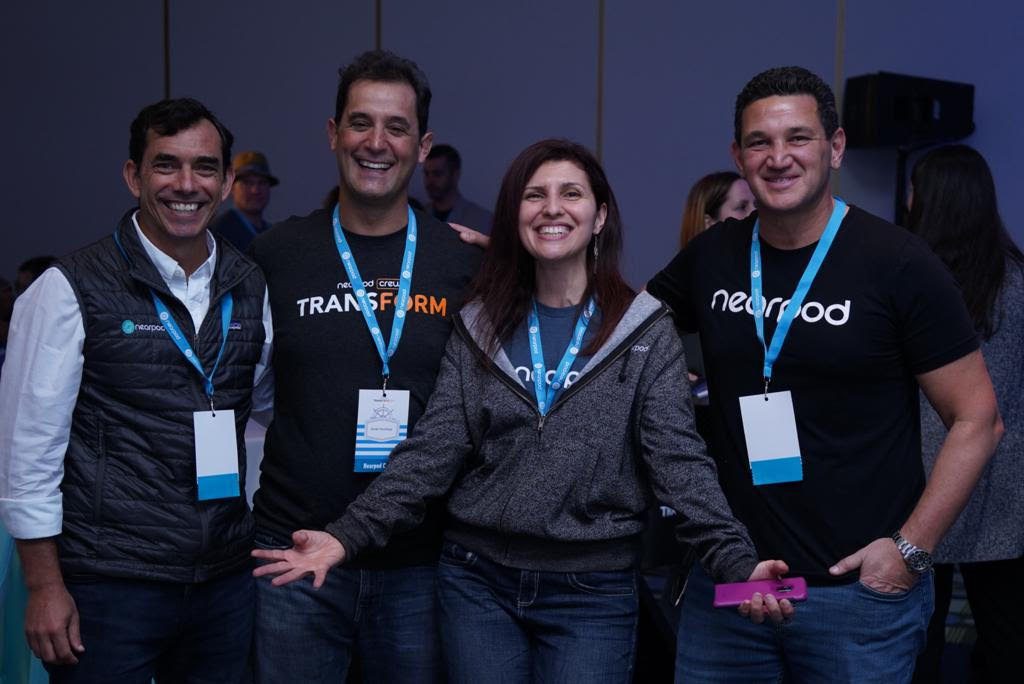 Nearpod’s three co-founders standing with a PioNear teacher advocate at the Transform conference