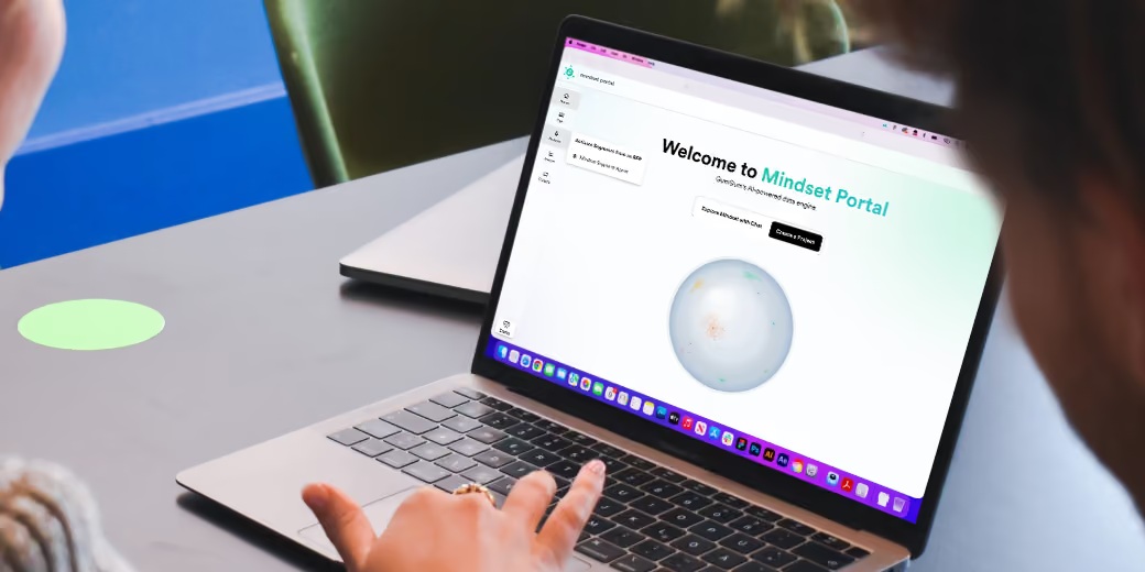 GumGum product image showing a person pointing to the Mindset Portal on a laptop