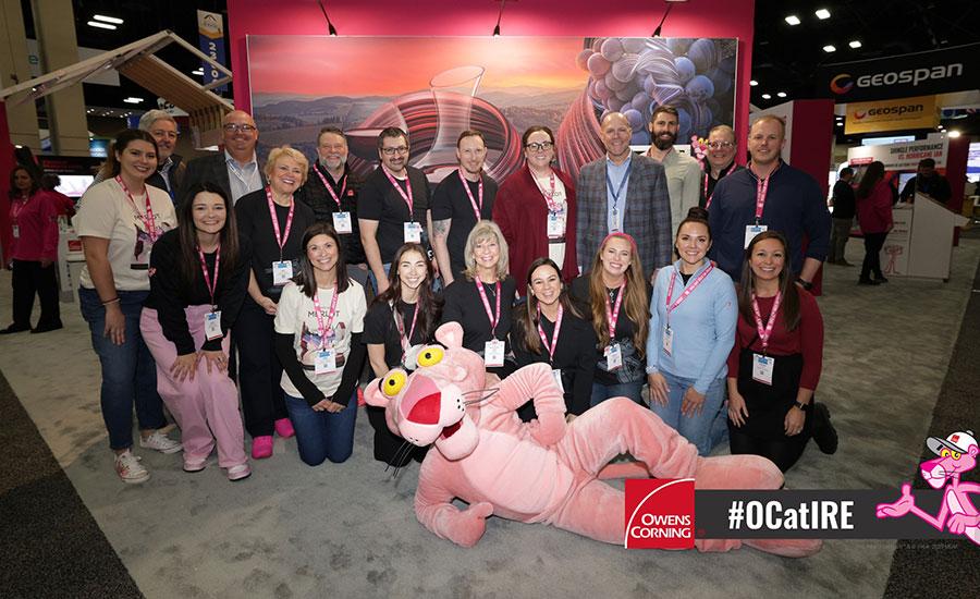 Owens Corning colleagues gathered at their booth during the 2025 International Roofing Expo