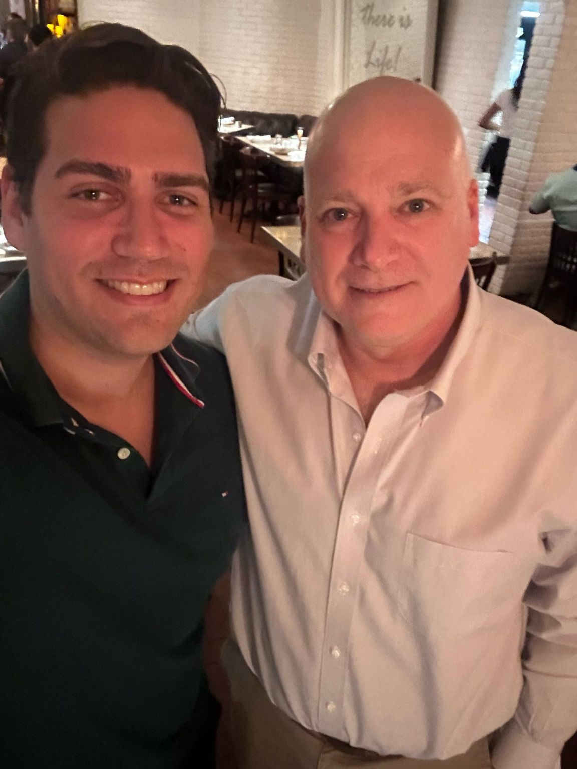 Nahuel Candia on the left and Gustavo Castenetto on the right, smiling during their Miami reunion
