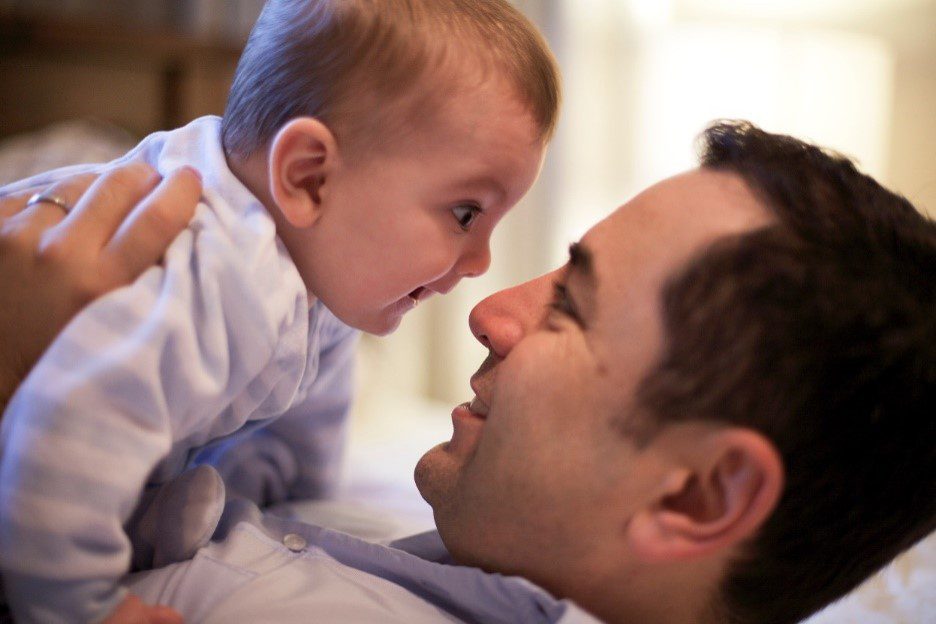 Gustavo Rodriguez holding his son Nico as a baby