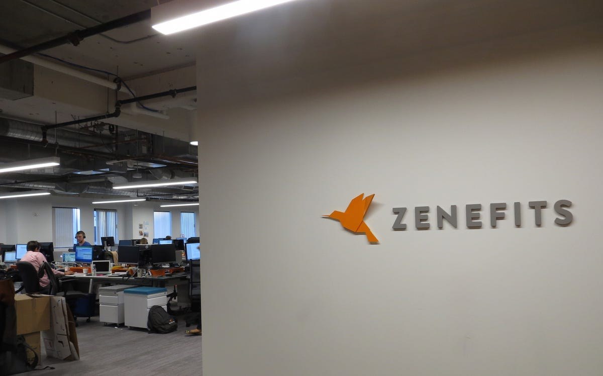The former Zenefits office with its orange bird logo and rows of desks