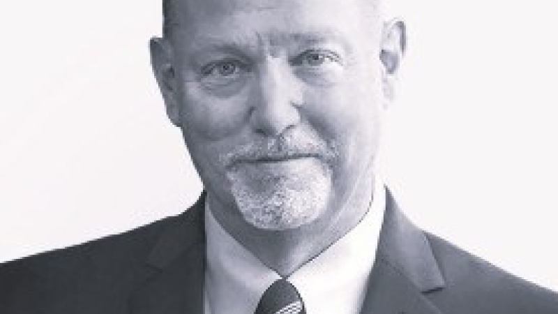 Black-and-white editorial portrait of Guy Abramo