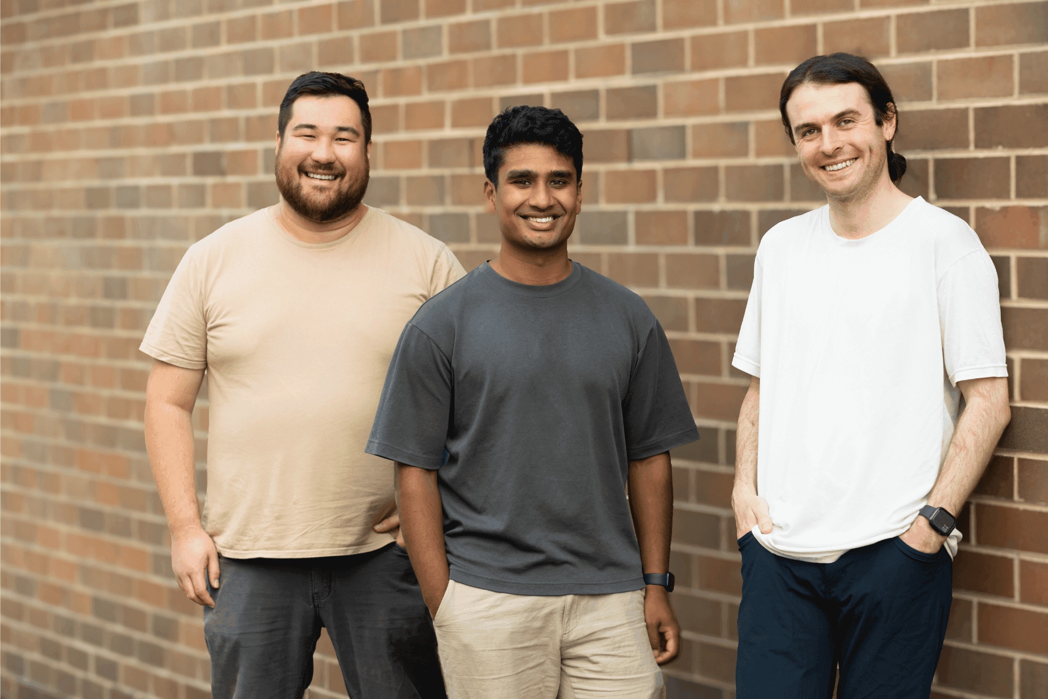Haast’s three co-founders photographed together against a brick wall