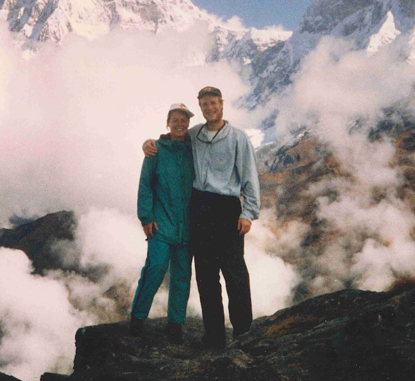 Sarah and Fred Haberman standing together in the Himalayas before founding their agency