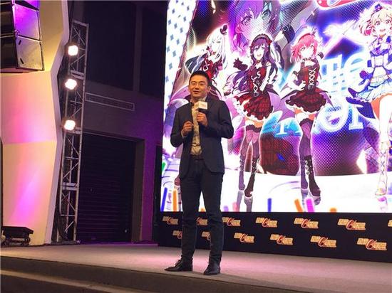 Haining Wang speaking onstage at the Idol Memories media screening in Beijing