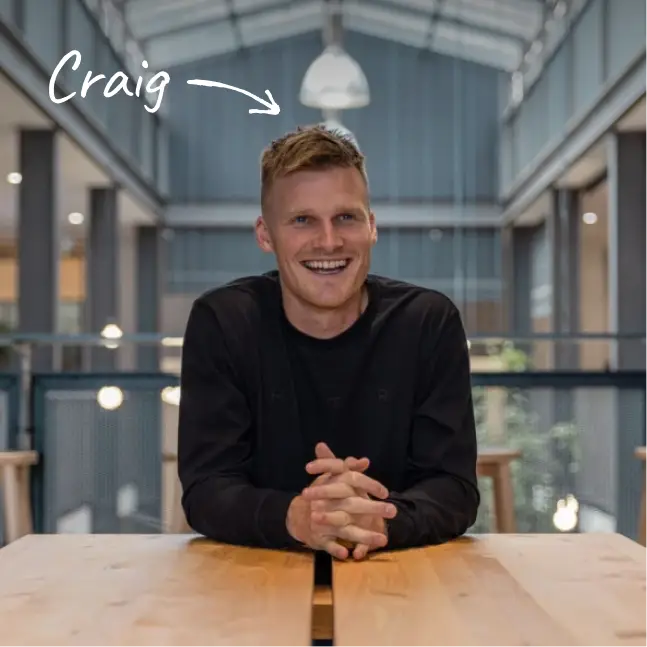 Halter co-founder and CEO Craig Piggott seated at a table