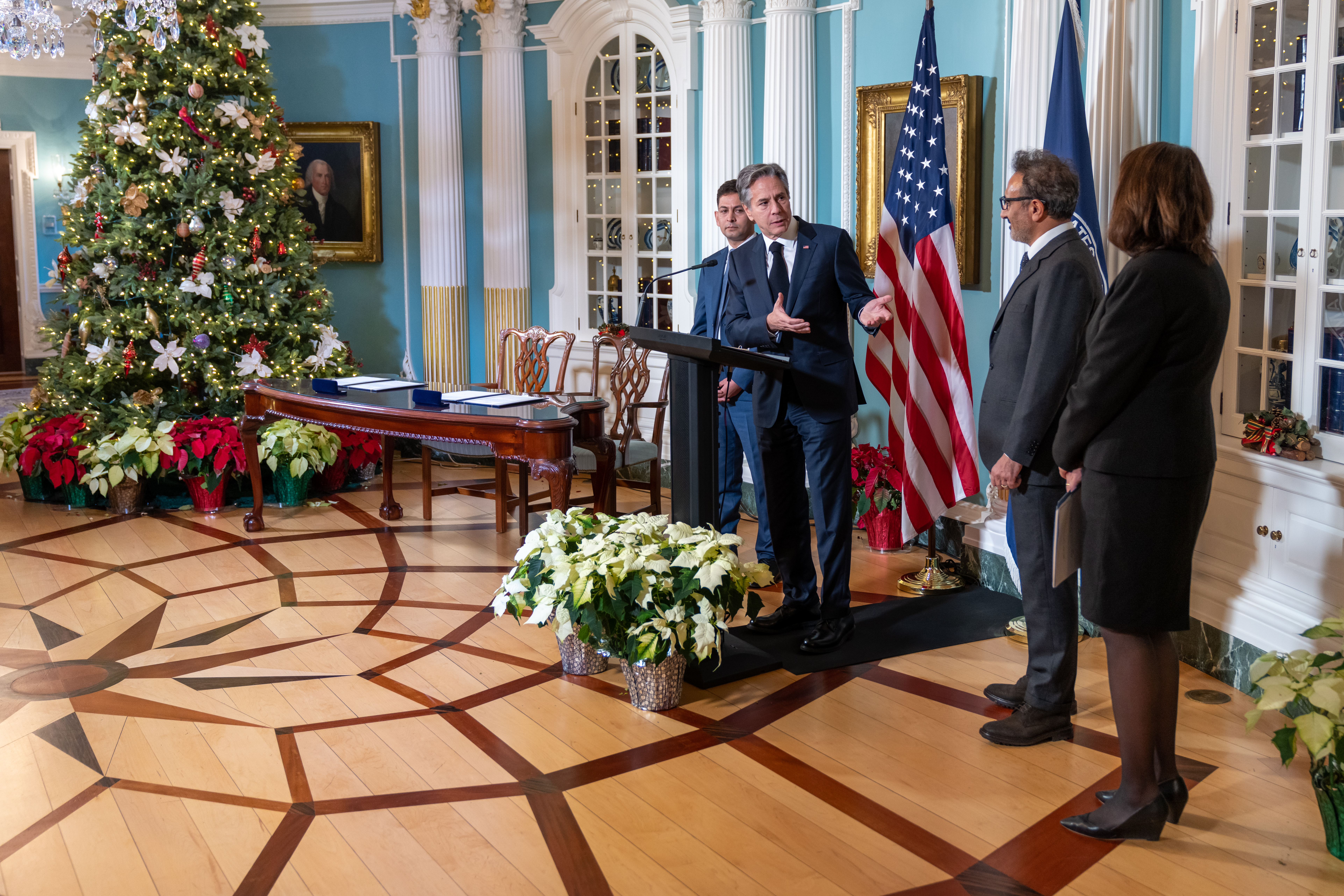 Secretary Antony Blinken speaks with Hamdi Ulukaya during a Tent Partnership signing ceremony at the U.S. Department of State