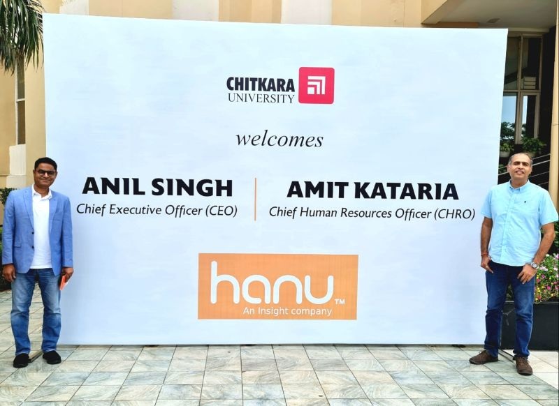 Anil Singh and Amit Kataria beside a Chitkara University welcome display during an Azure Academy partnership visit