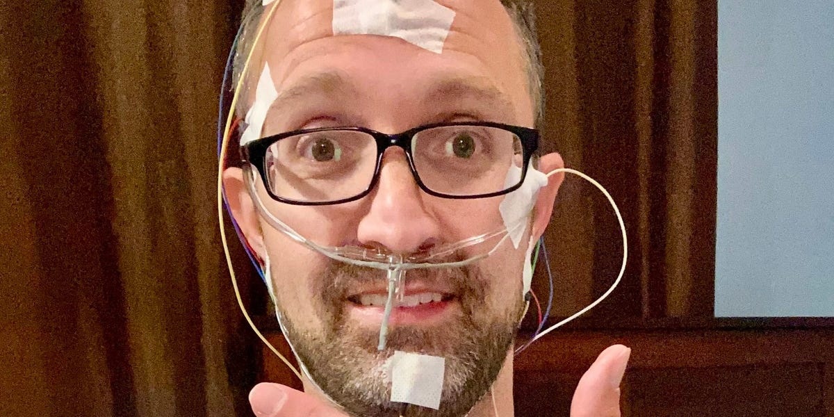 Dustin Freckleton wearing conventional sleep-testing sensors
