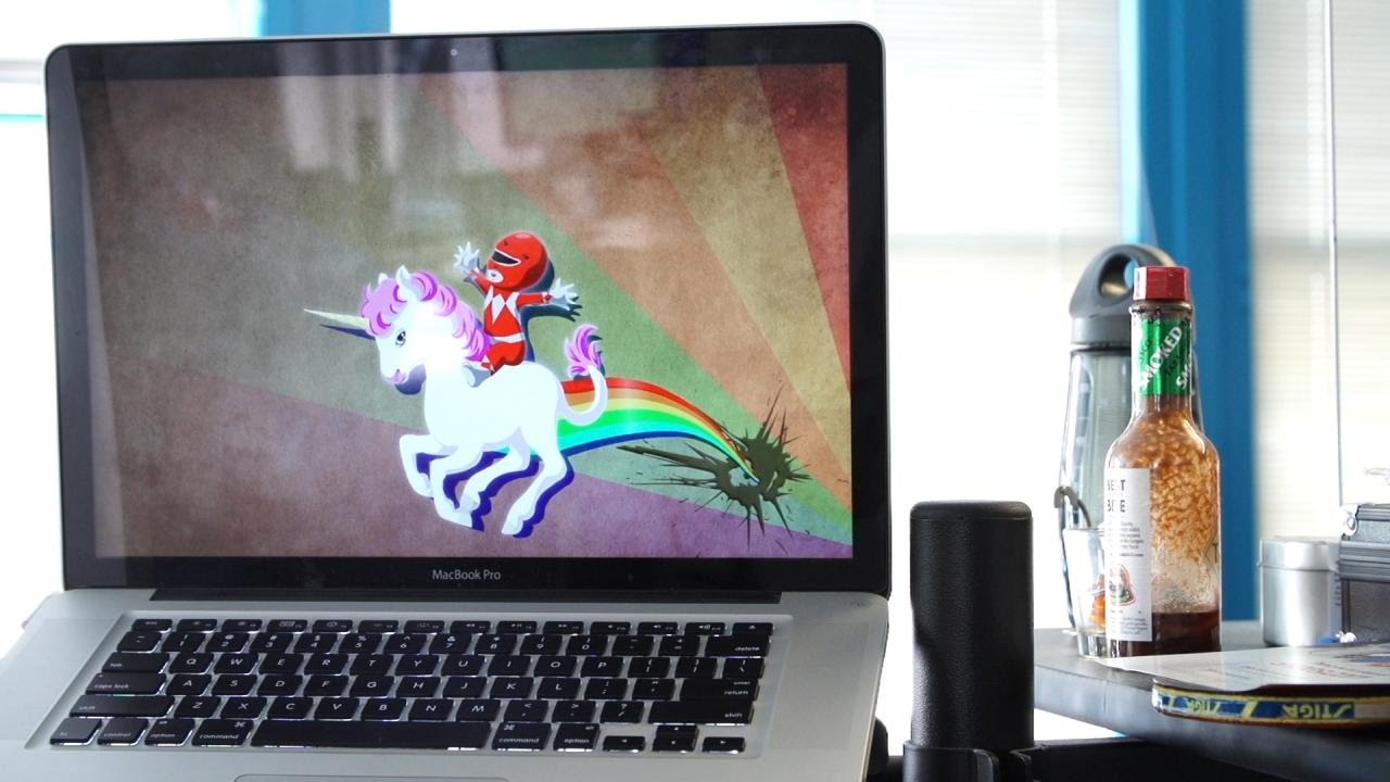 A laptop at Pocket Gems displaying a playful unicorn and red-suited rider
