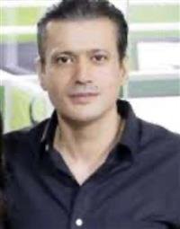 An archival press photograph of Harman Dhawan
