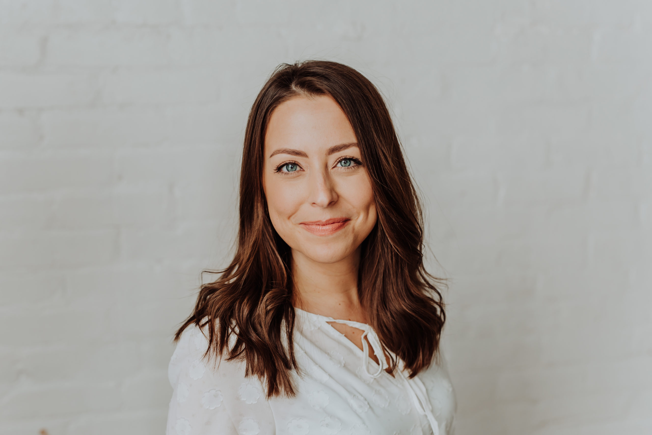 Rachel Mills, founder of Harmony Consulting, in a bright studio portrait