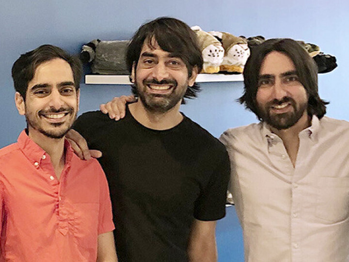 Idris, Zeki and Haroon Mokhtarzada standing together, from left to right