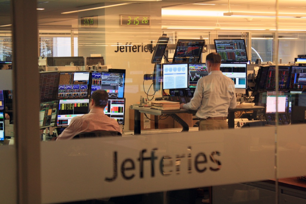 Jefferies trading floor with traders at multiple market screens
