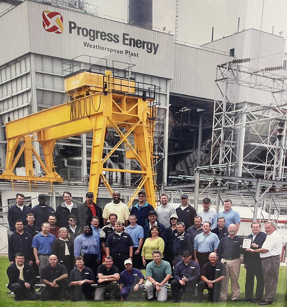 Harry Sideris with colleagues in an archival Weatherspoon Plant group photograph, front row at far left
