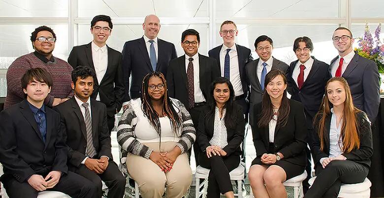 Rutgers students meeting Harvey Schwartz at a reception