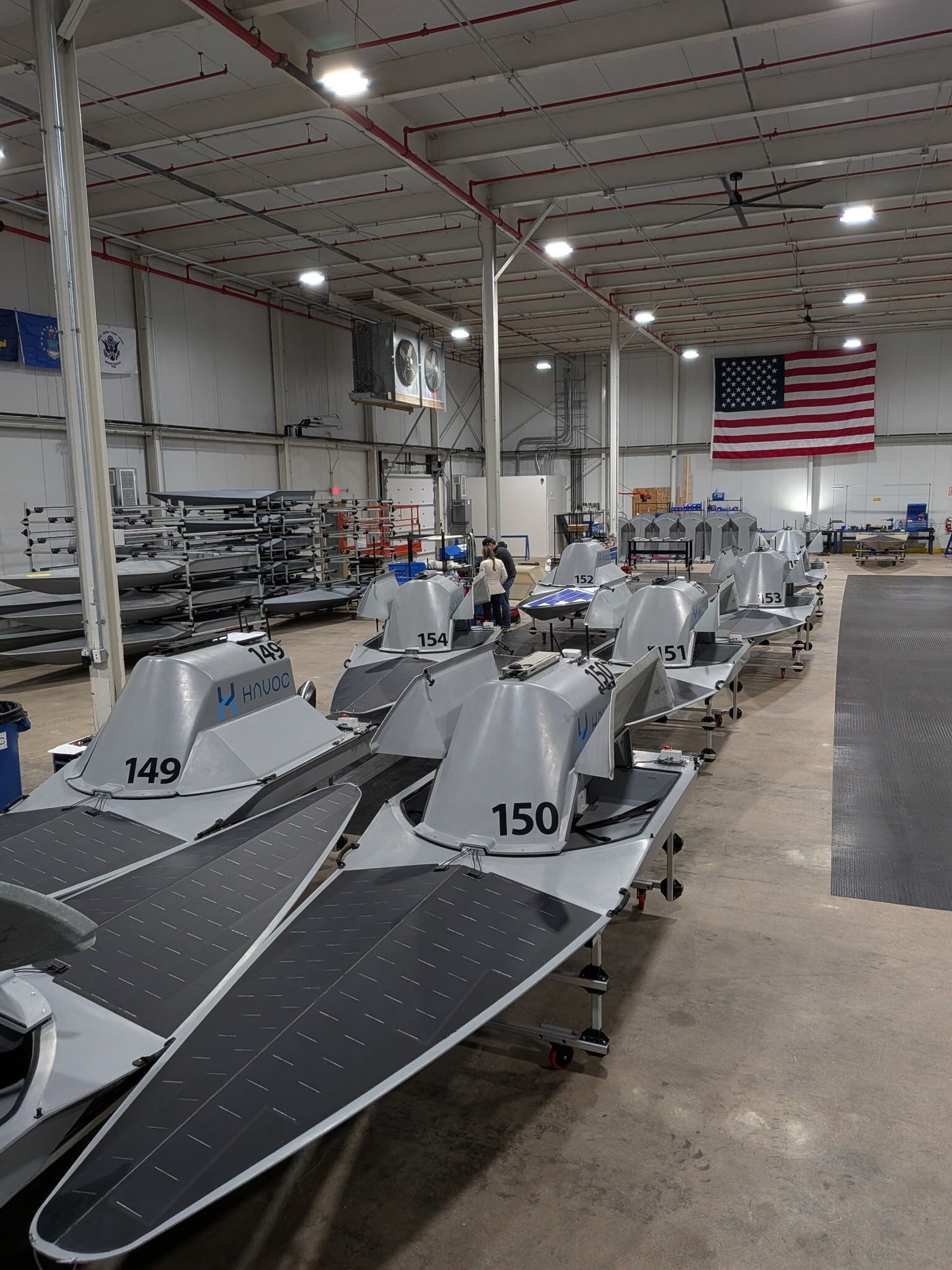 Rows of HavocAI Rampage autonomous vessels inside a production facility