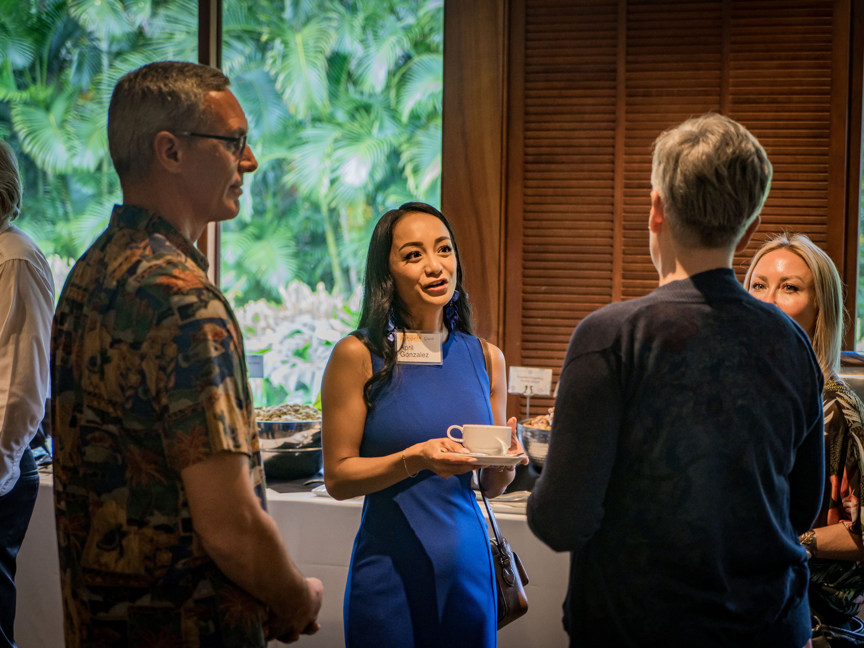 Attendees talk over coffee at a Hawaiʻi Angels gathering