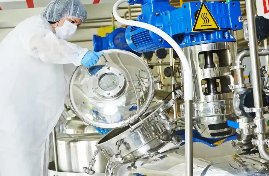 Hawkins employee working with chemical blending equipment