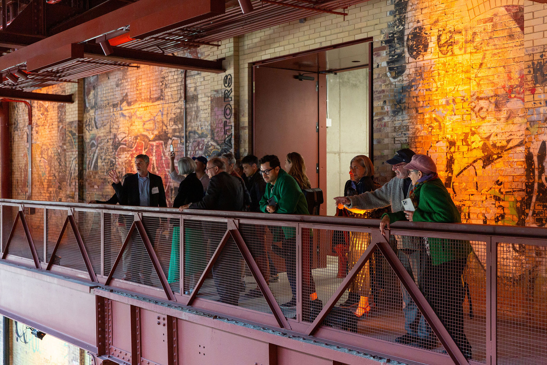 Visitors touring the brick interior of Powerhouse Arts in Brooklyn