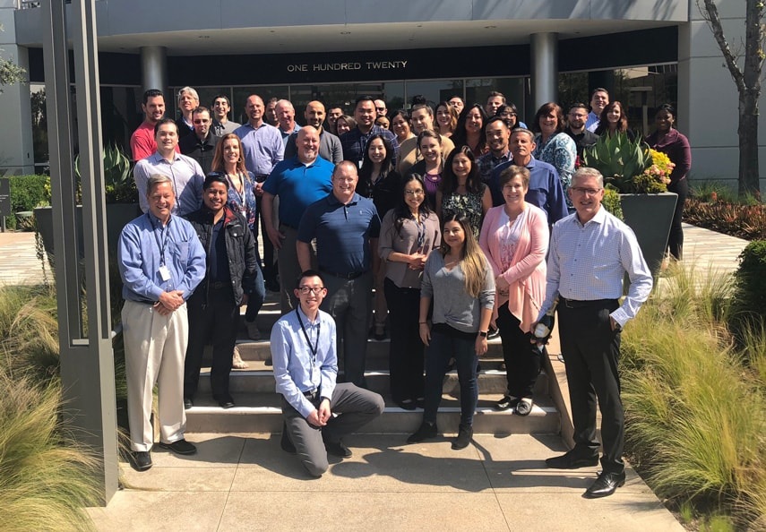 HdL colleagues posing together outside their office