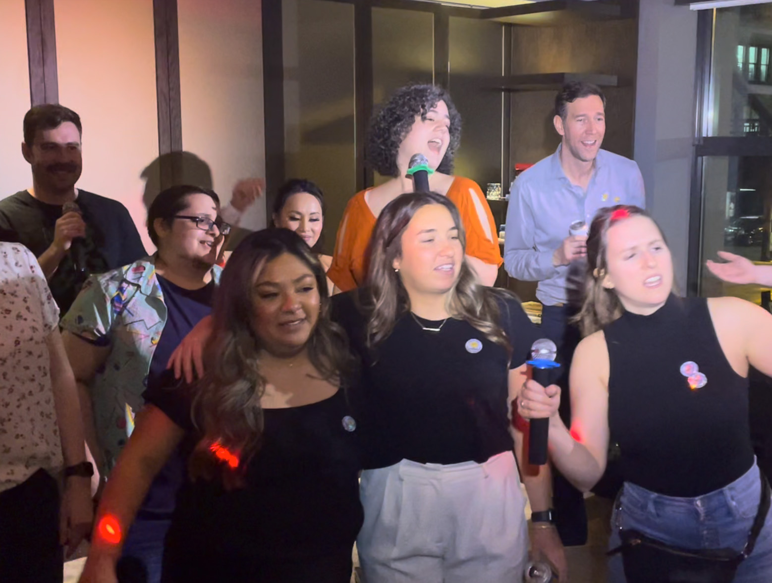 HDMZ employees singing karaoke together during the agency's 2024 summit in Chicago