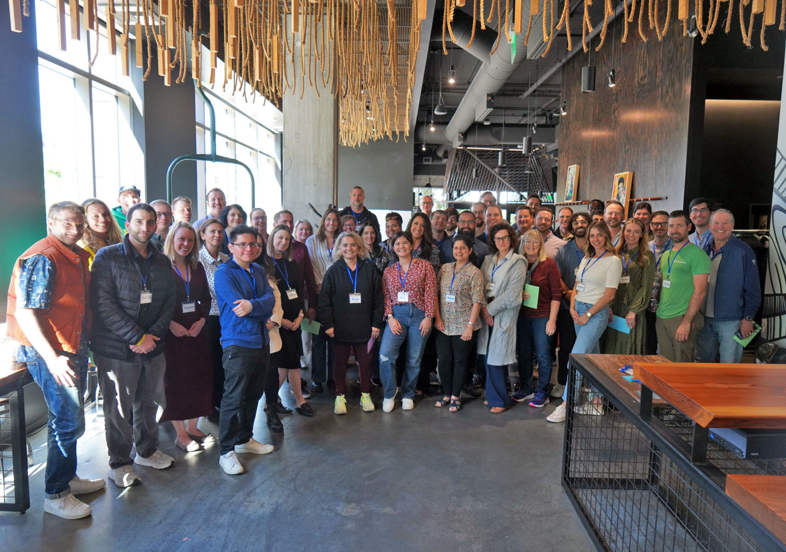 A large group of HeadLight employees gathered in a Seattle office