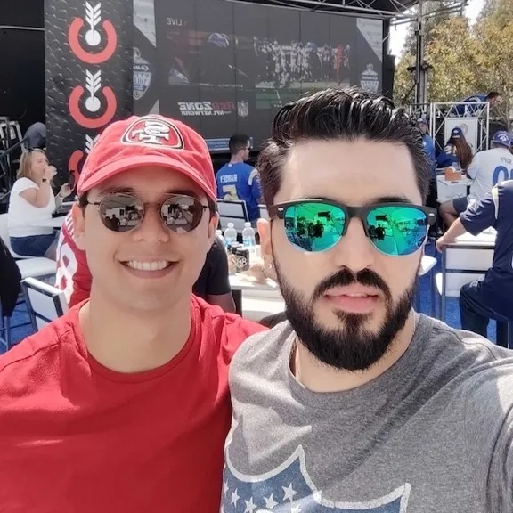 Two people pictured in HeadQuarters’ public team gallery at an outdoor event