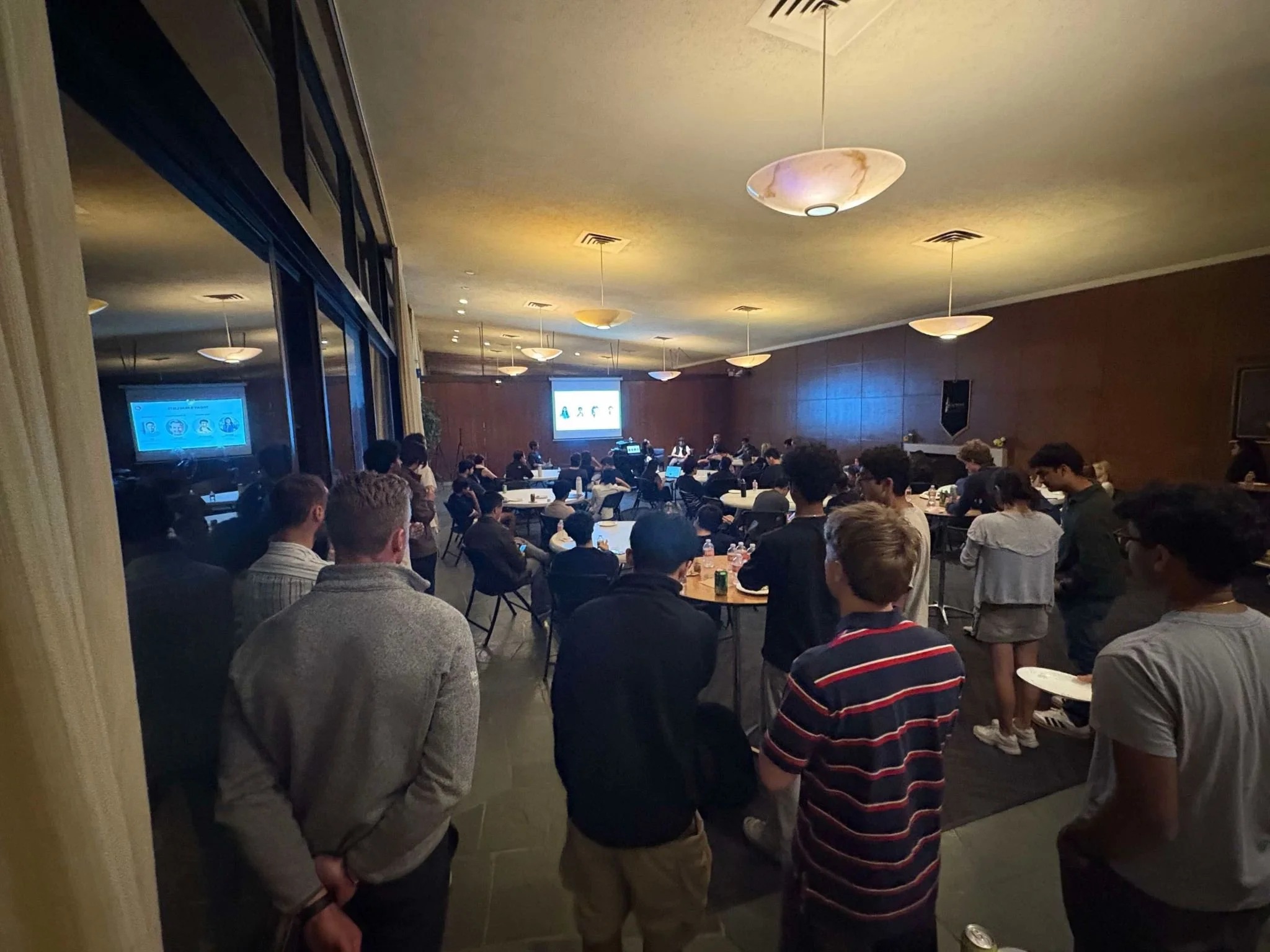Attendees gathered at round tables facing a panel at Health Engine’s SF Tech Week mixer