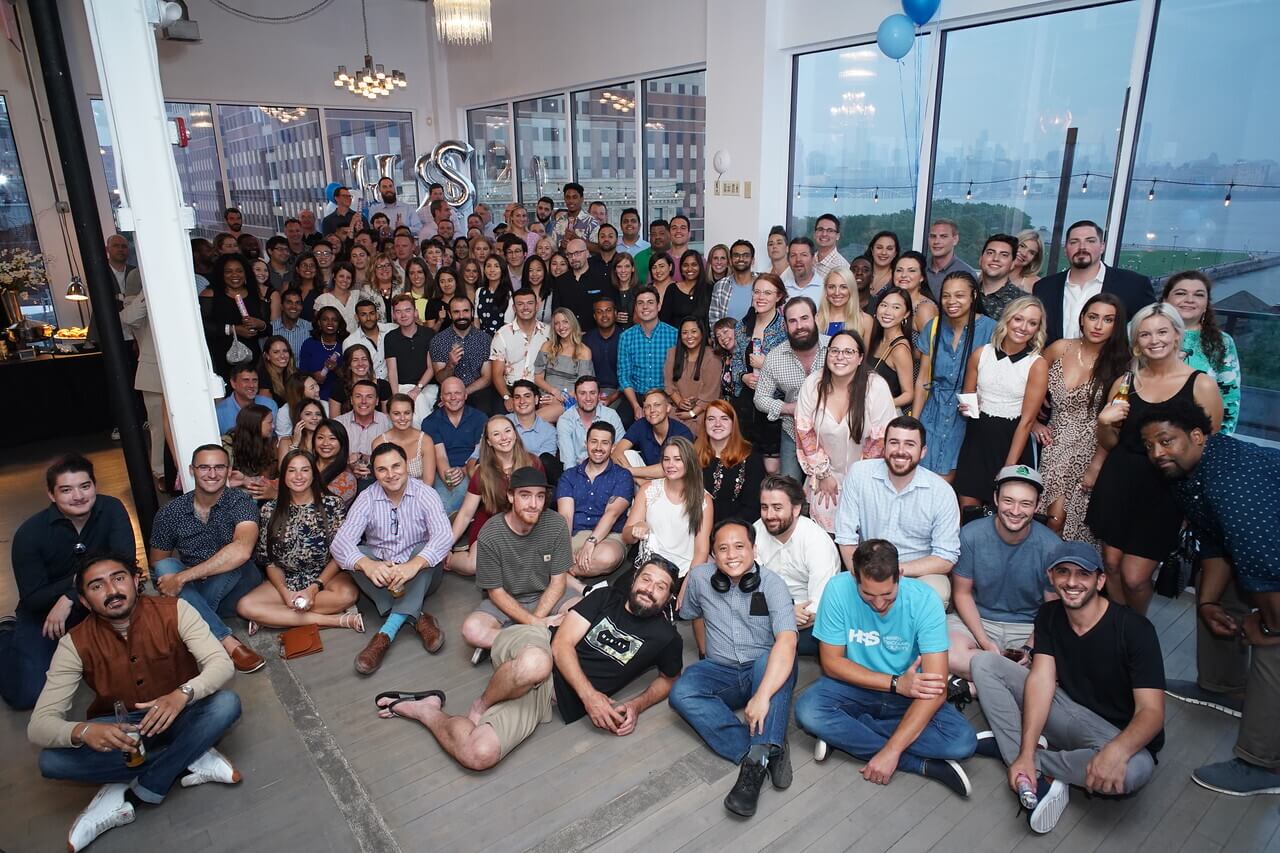 HRS employees gather for a group photograph at a company event.