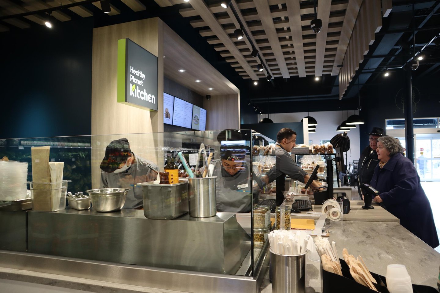 Staff serve customers at the Healthy Planet Kitchen counter inside the Etobicoke flagship