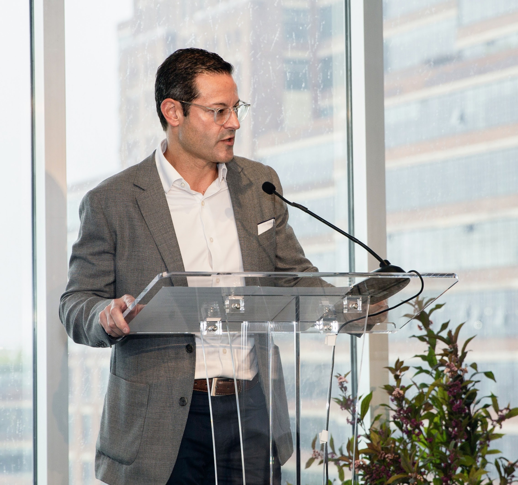 Heath Golden speaking from a transparent podium at the Martha Stewart brand summit