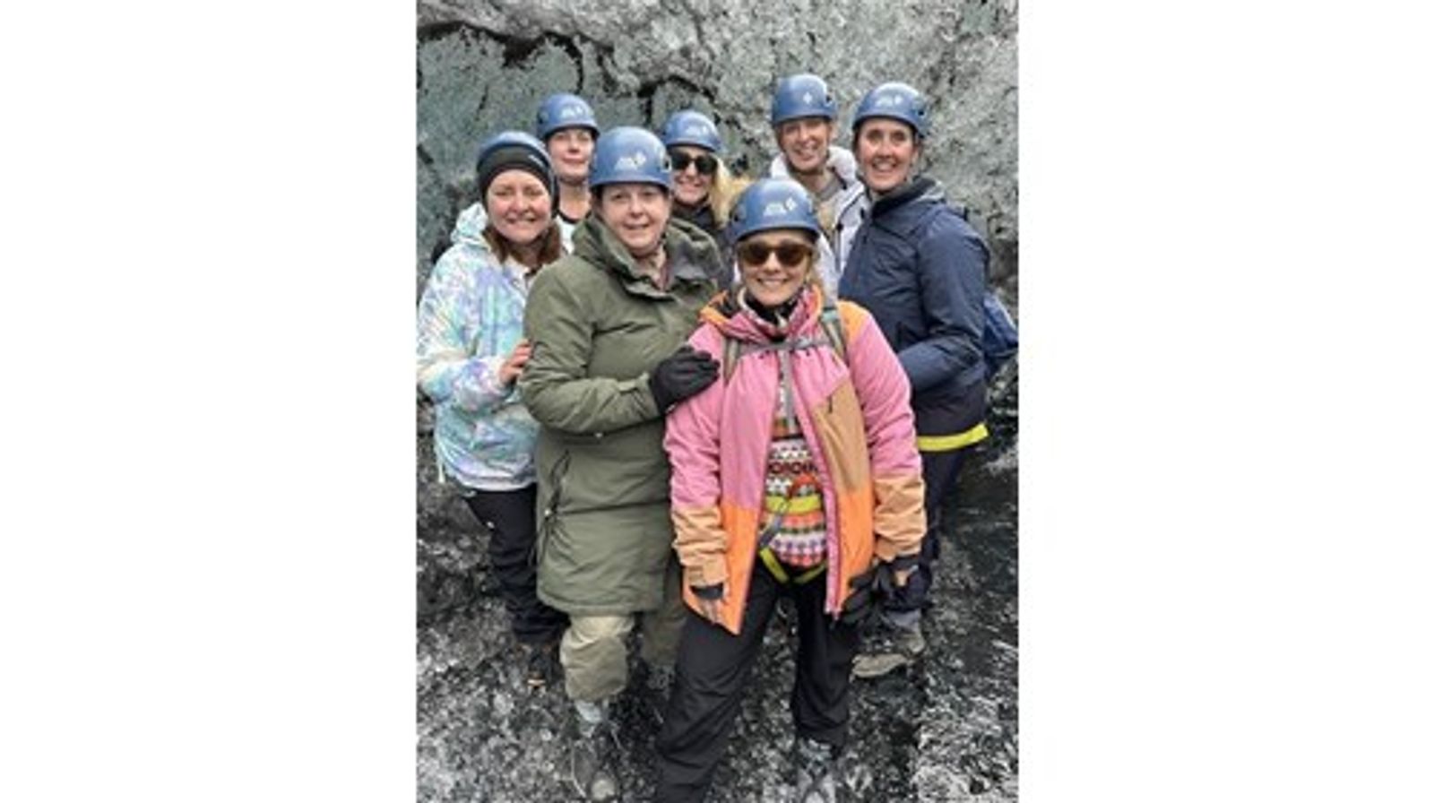 Heather Lea with a hosted group wearing helmets during an Iceland adventure