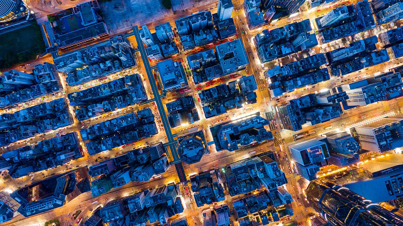 An illuminated city grid seen from directly above at night