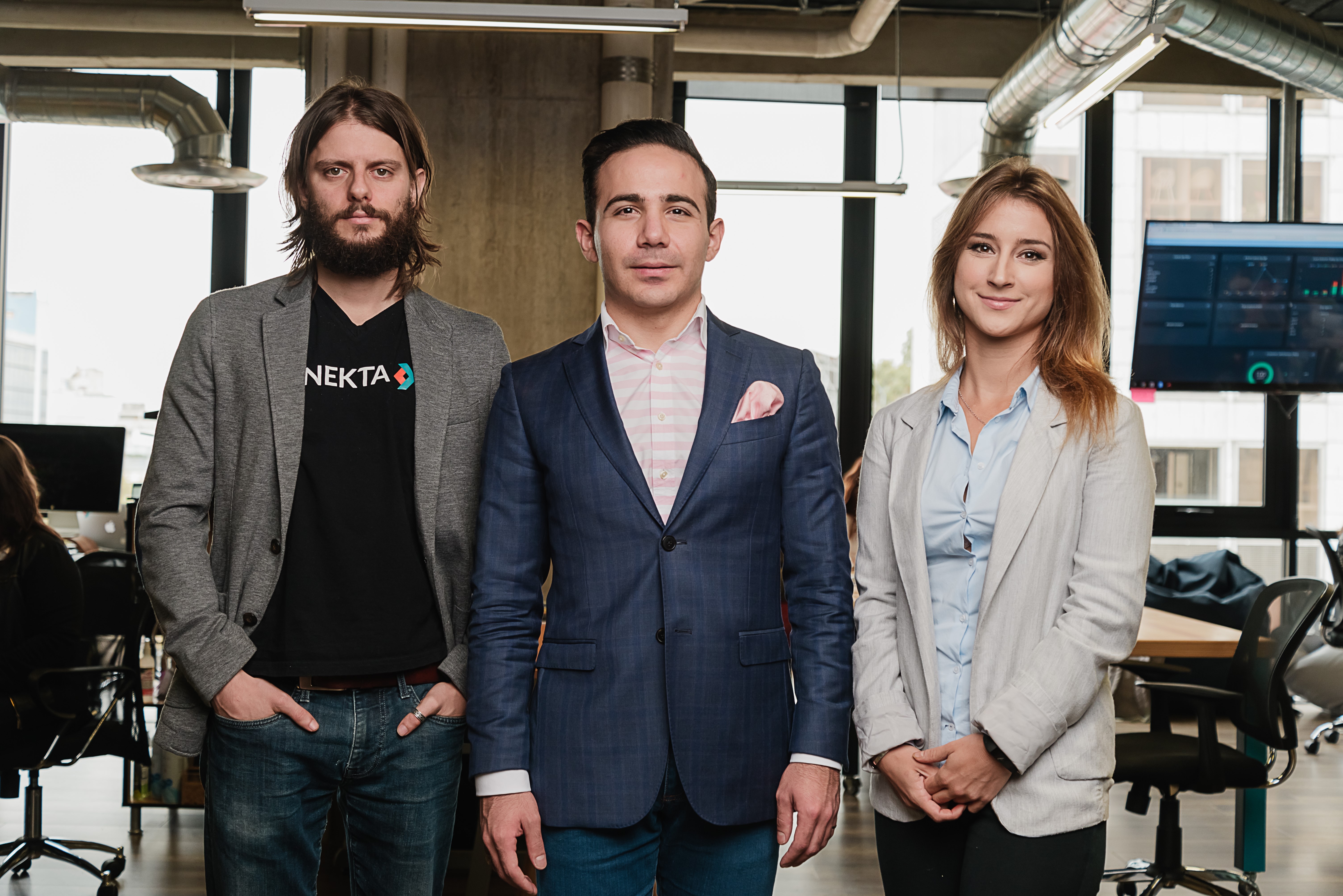 Conekta cofounders Leo Fischer, Héctor Cárdenas and Cristina Randall standing together in an office